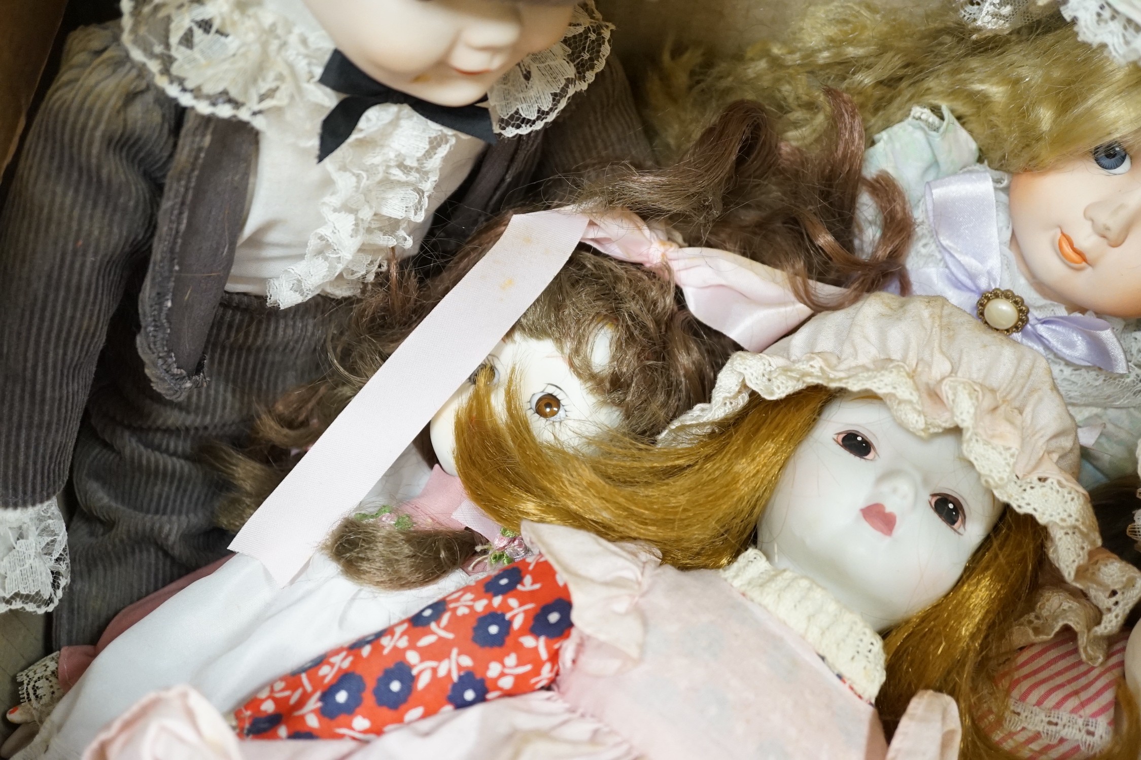 A quantity of various dolls